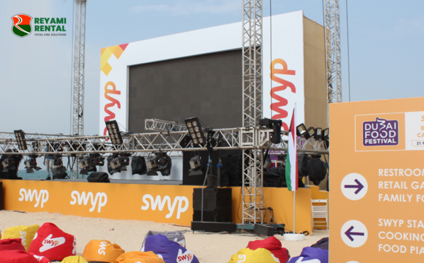 Reyami Rental outdoor stage setup at Dubai Food Festival with LED screen and seating area